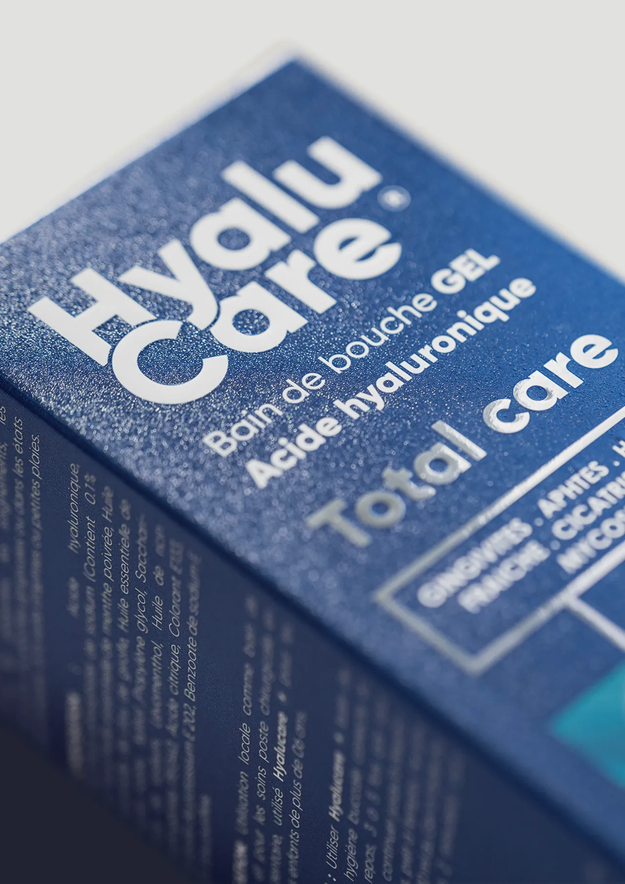 HyaluCare for Natural Solution, printed — metallic blue board, the name and “Total care” in silver foil